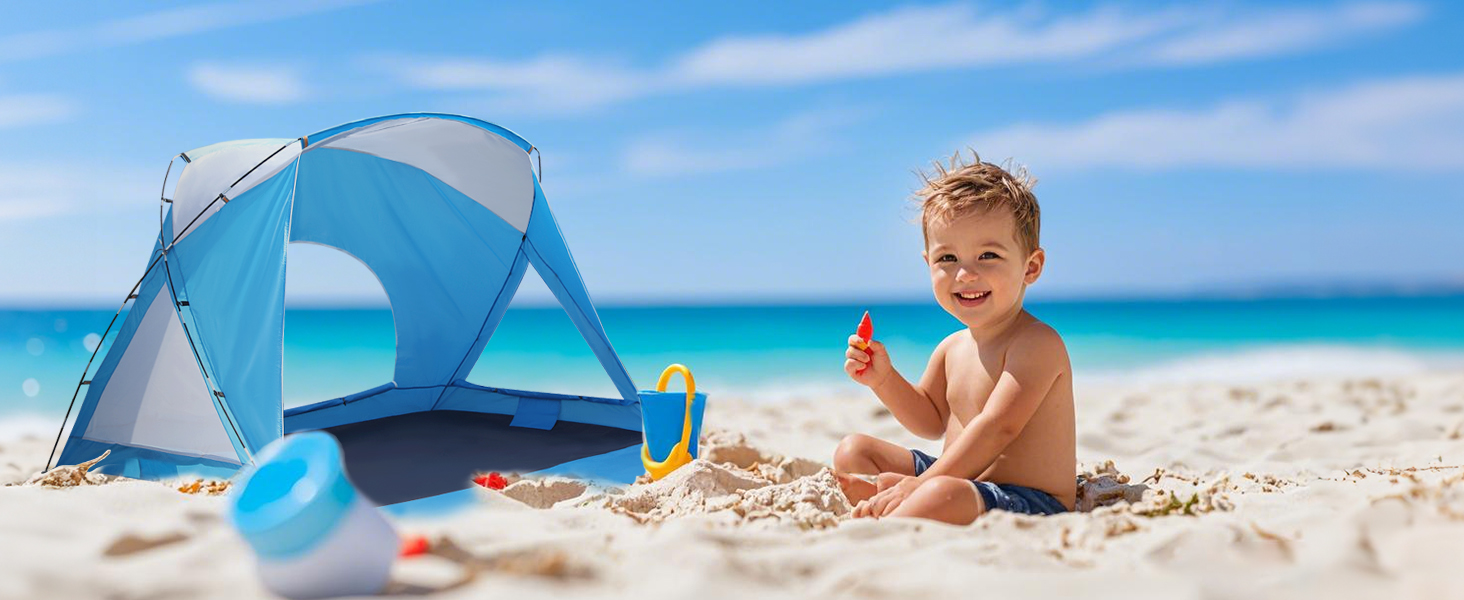A child plays next to a tent on the beach