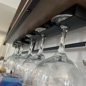The tape of the wine glass holder must be glued to the flat and smooth surface of the closet. 